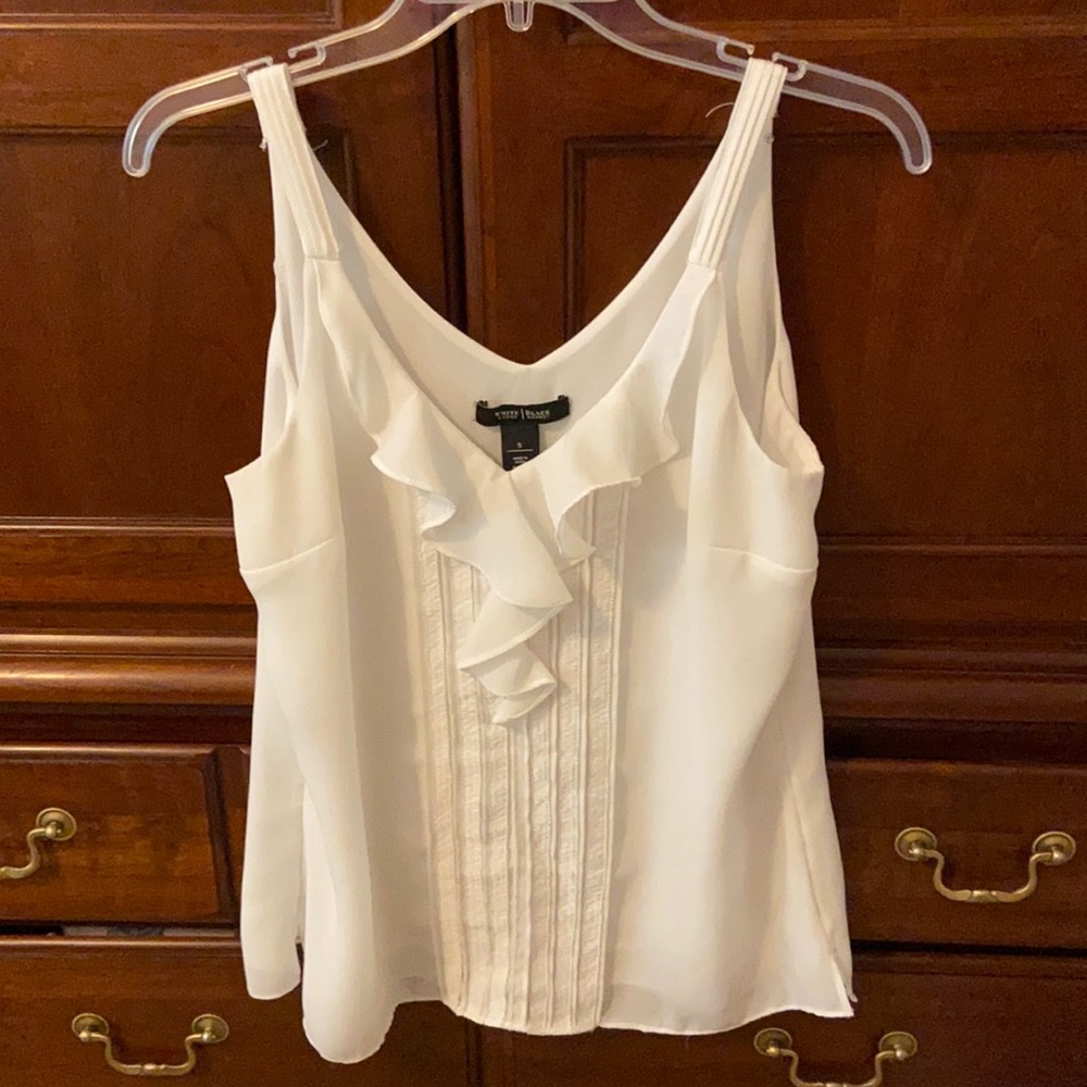 White sleeveless blouse. Ruffled and detailed front.  Lined. WHBM Small